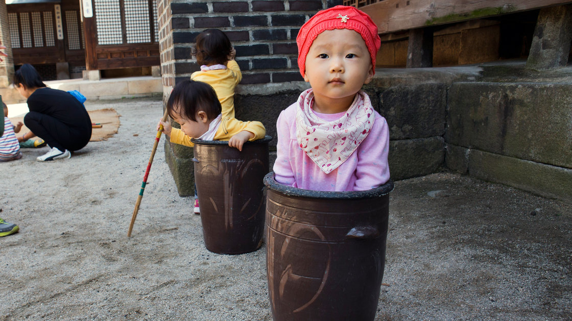 Jung Ha-yoon, 2, and other children in Seoul, South Korea, enjoy playing around (and in) ceramic jars. The country's infant mortality rate dropped 91 percent between 1972 and 2012.